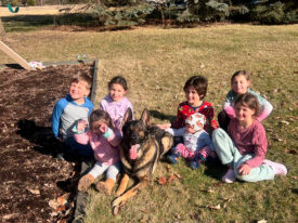 family protection dog with kids in park